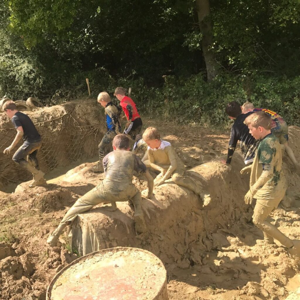 Schools group in mud trench